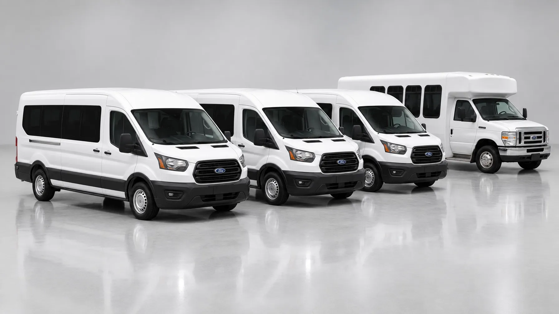 White Ford Transit vans with a white minibus behind them on a light gray studio backdrop